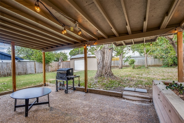 exterior space featuring grilling area and a storage unit