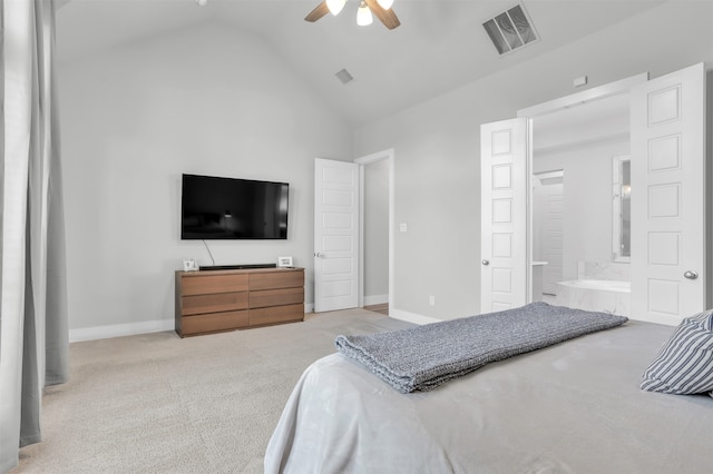 carpeted bedroom with vaulted ceiling, ensuite bathroom, and ceiling fan