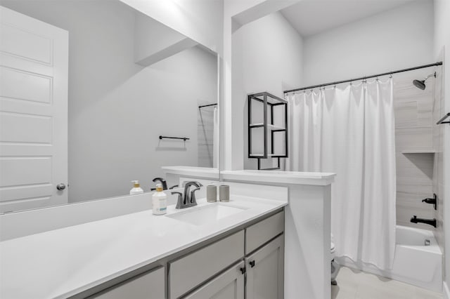 full bathroom featuring toilet, shower / tub combo with curtain, and vanity