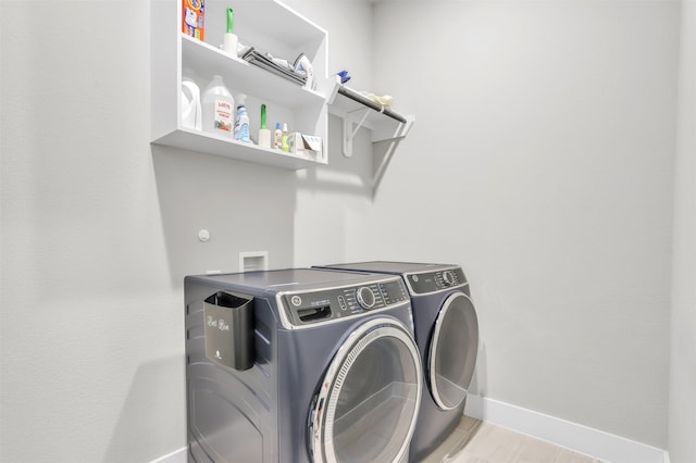 laundry area featuring washing machine and dryer