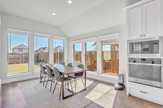 sunroom / solarium with vaulted ceiling