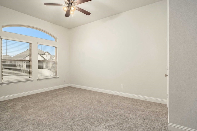 unfurnished room with carpet flooring and ceiling fan