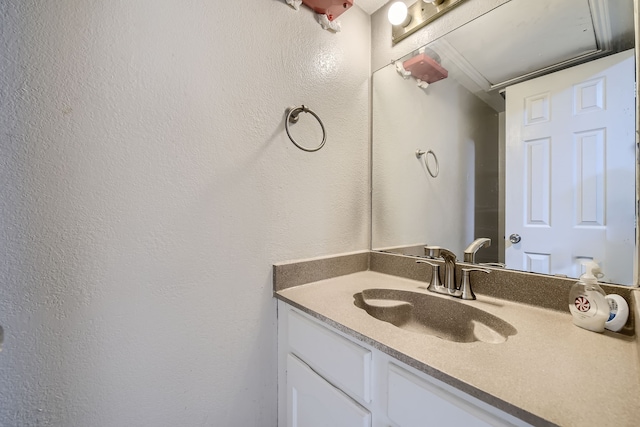 bathroom featuring vanity and crown molding