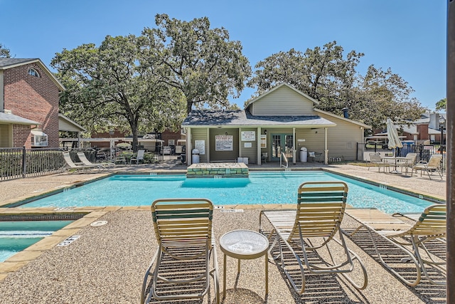 view of swimming pool with a patio area