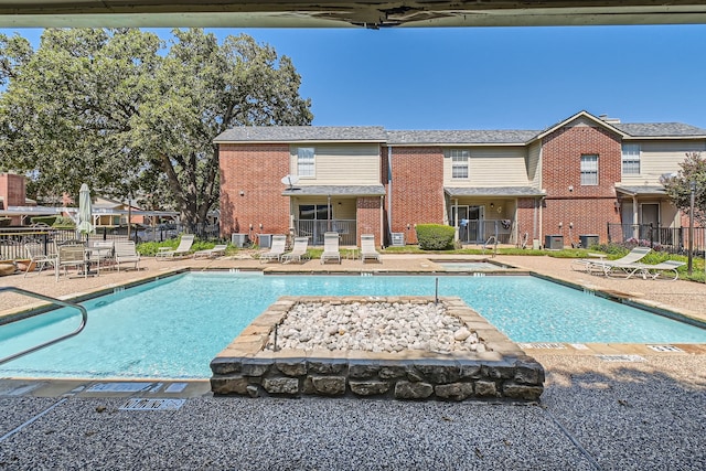 view of swimming pool with a patio area