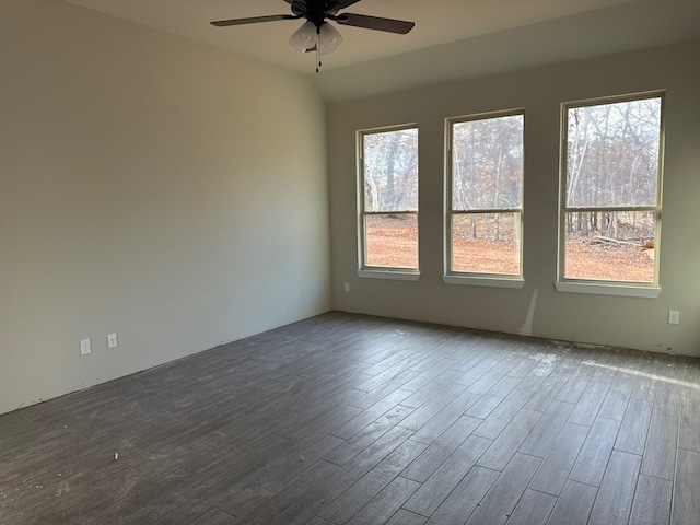 unfurnished room featuring ceiling fan, dark hardwood / wood-style flooring, and lofted ceiling