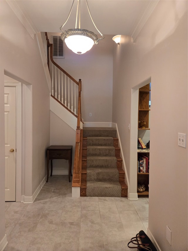 stairs featuring ornamental molding