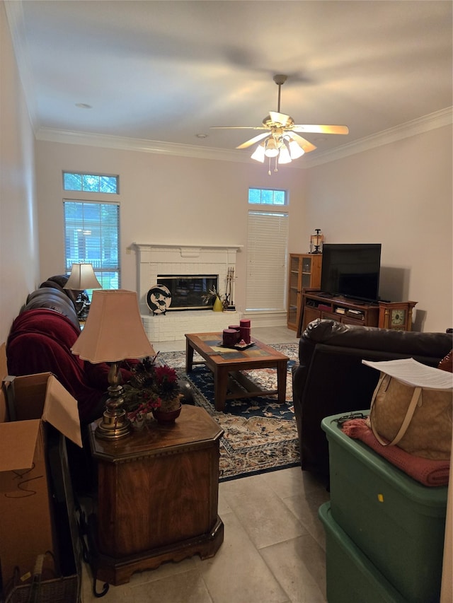 tiled living room featuring ceiling fan, plenty of natural light, and ornamental molding