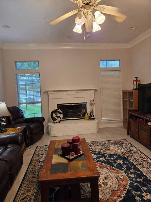 living room featuring a fireplace, crown molding, light tile patterned floors, and ceiling fan