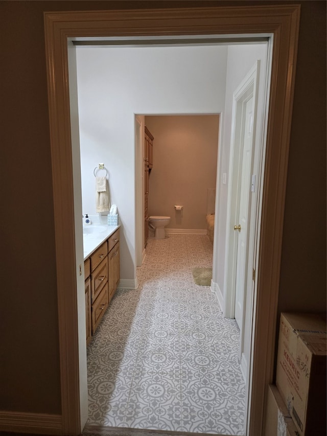 bathroom with toilet and vanity