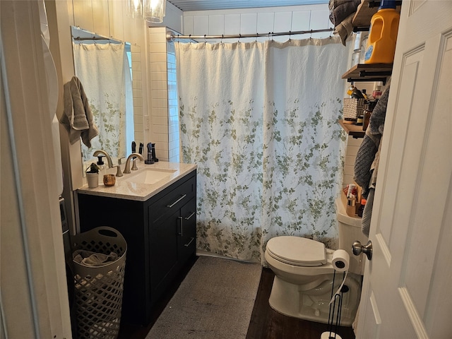 bathroom featuring vanity, tile patterned flooring, and toilet