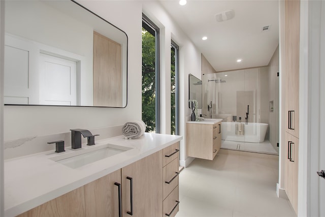 bathroom featuring separate shower and tub and vanity