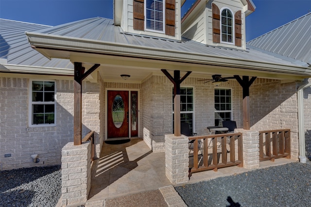 property entrance featuring ceiling fan and a patio area