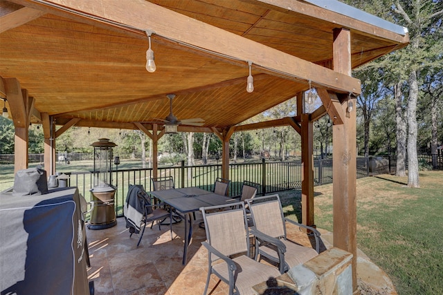 view of patio / terrace with ceiling fan and a gazebo