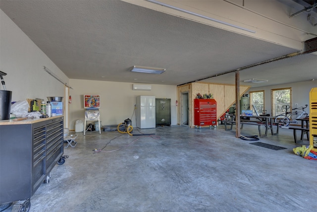 garage featuring white fridge