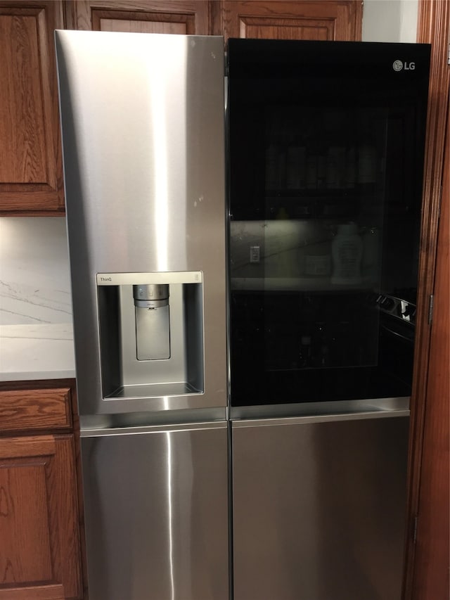 interior space featuring stainless steel fridge