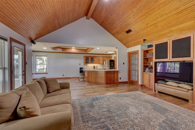 living room with wooden ceiling, light hardwood / wood-style flooring, beam ceiling, sink, and high vaulted ceiling