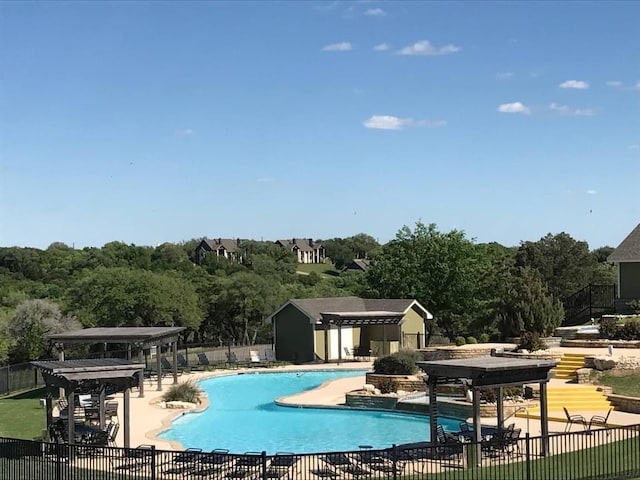 view of swimming pool featuring a patio area