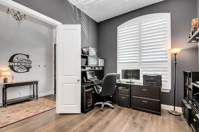 office space with light wood-type flooring