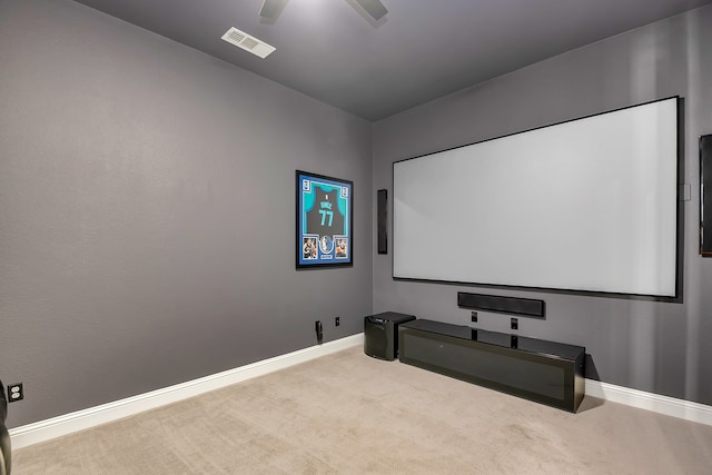 home theater room featuring light colored carpet and ceiling fan