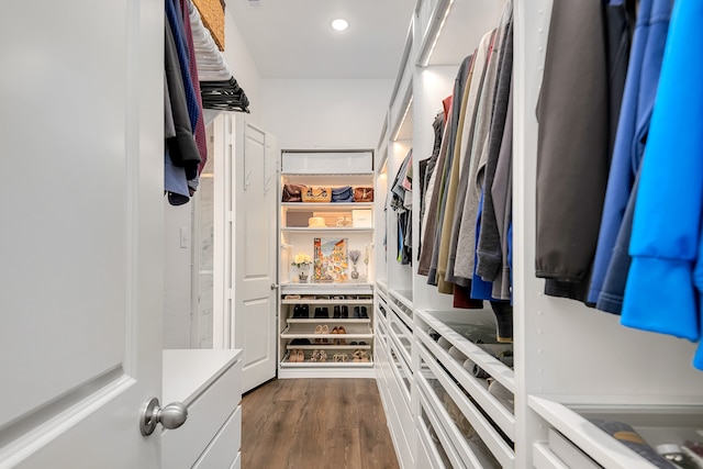 walk in closet featuring dark wood-type flooring