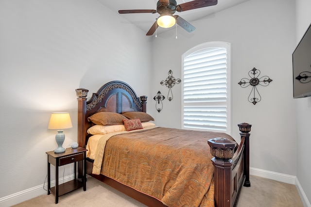 bedroom with light colored carpet and ceiling fan