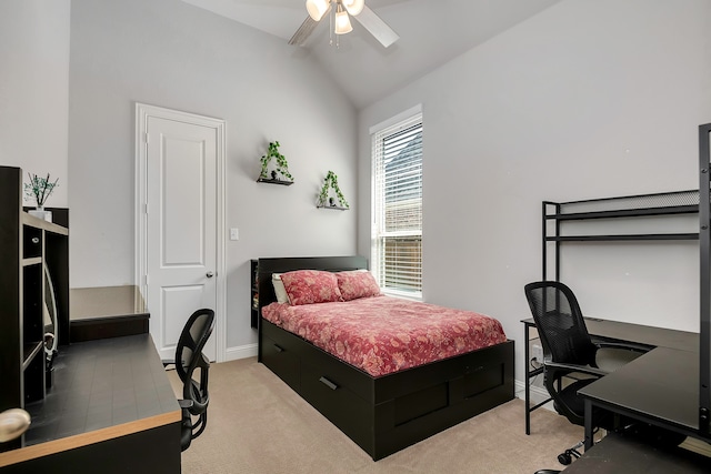 carpeted bedroom featuring ceiling fan and vaulted ceiling