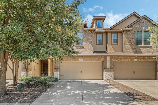 multi unit property featuring a garage