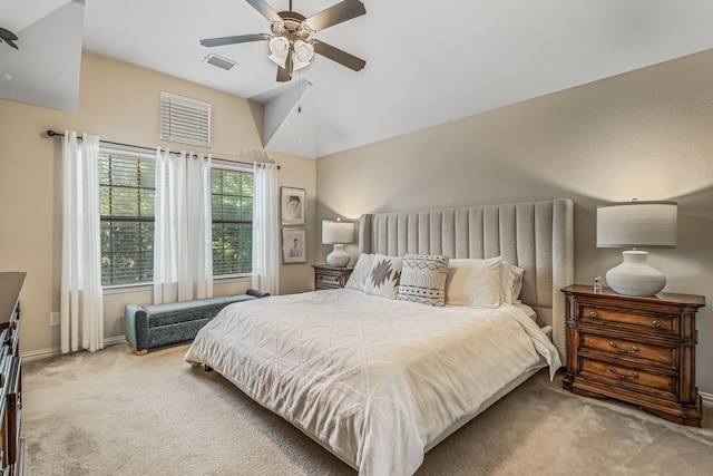 bedroom with light colored carpet, ceiling fan, and lofted ceiling