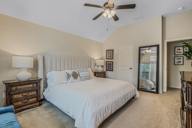 carpeted bedroom featuring lofted ceiling and ceiling fan