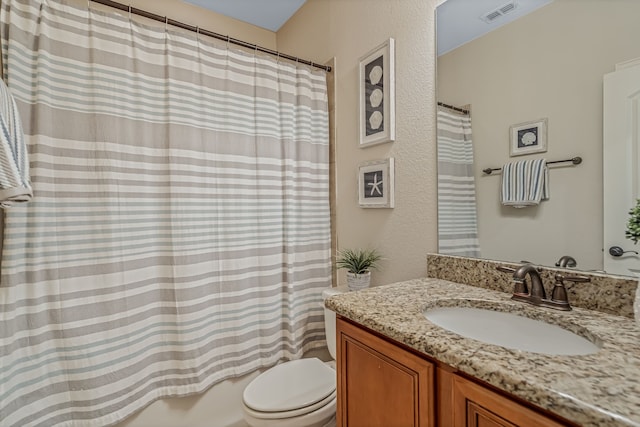 full bathroom with shower / bath combo, toilet, and vanity