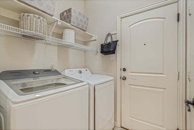 laundry area with separate washer and dryer