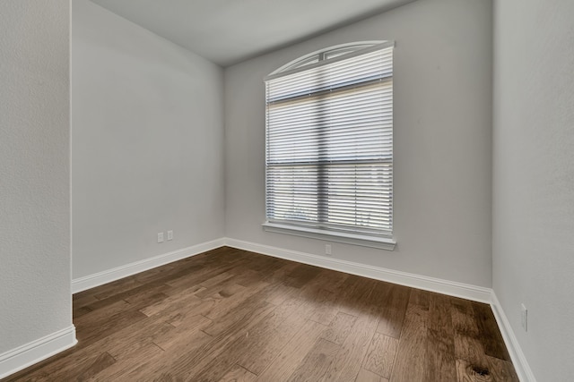 spare room featuring hardwood / wood-style floors