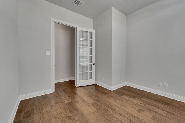 unfurnished bedroom with hardwood / wood-style flooring