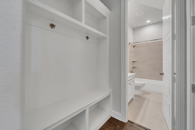 mudroom with wood-type flooring