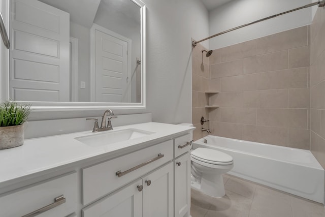 full bathroom with tile patterned flooring, vanity, toilet, and tiled shower / bath combo