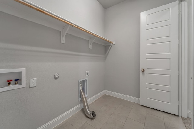 laundry room with hookup for a washing machine, light tile patterned floors, electric dryer hookup, and hookup for a gas dryer