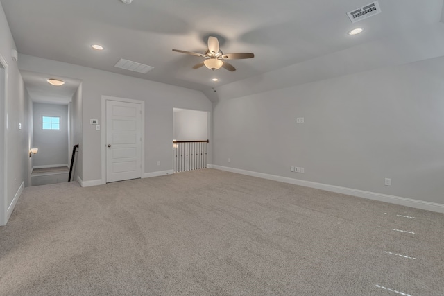 carpeted spare room with ceiling fan