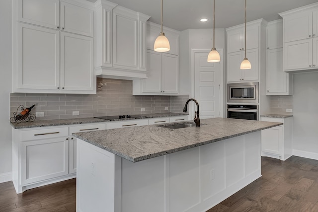 kitchen with dark hardwood / wood-style flooring, sink, and white cabinets