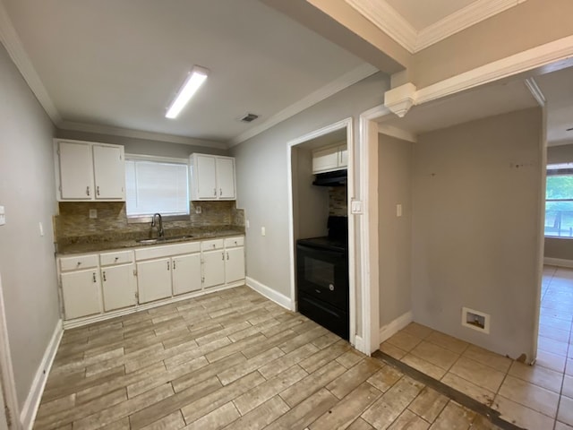 kitchen featuring crown molding, sink, white cabinetry, black electric range oven, and light wood-type flooring