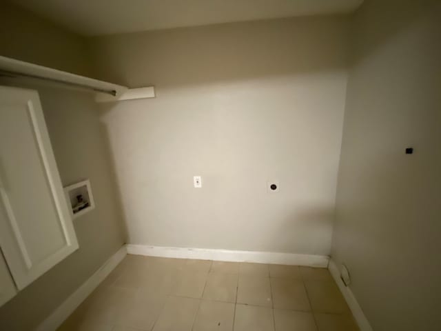 laundry area with washer hookup, light tile patterned floors, and electric dryer hookup