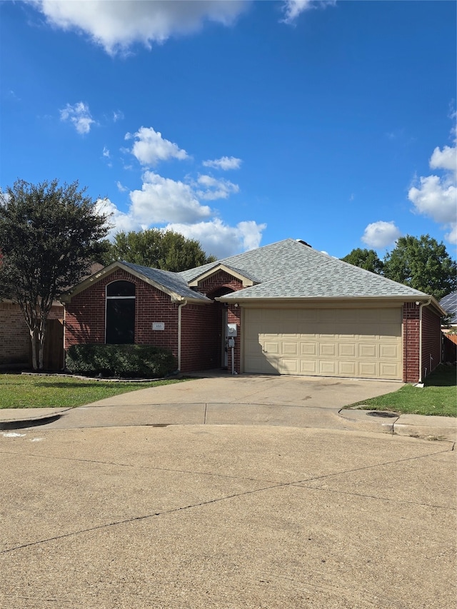 ranch-style home featuring a garage