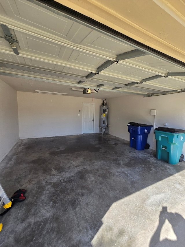 garage with a garage door opener and water heater