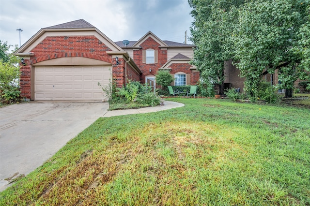 view of front of house with a garage and a front yard