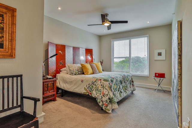 carpeted bedroom featuring ceiling fan