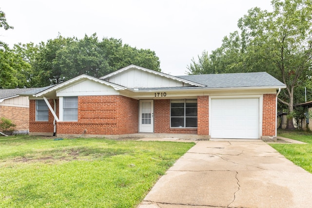 ranch-style home with a front yard and a garage