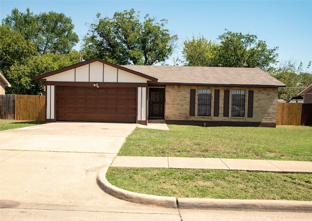 ranch-style home featuring a front lawn and a garage