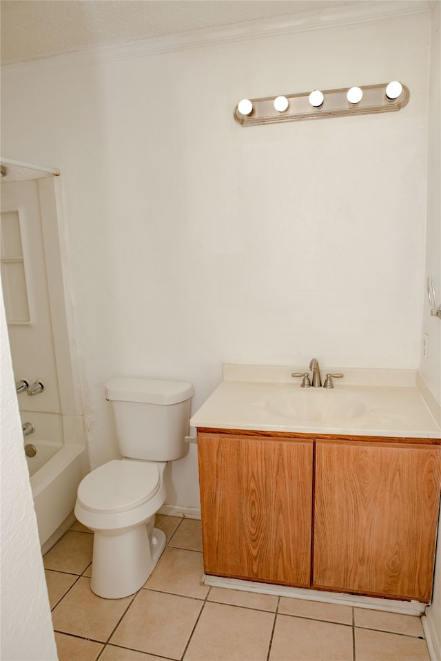 full bathroom featuring vanity, tile patterned flooring, crown molding, toilet, and washtub / shower combination