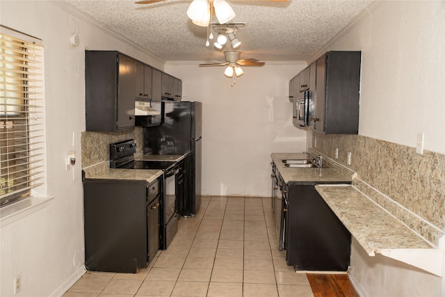 kitchen with a textured ceiling, light tile patterned floors, black appliances, sink, and ceiling fan