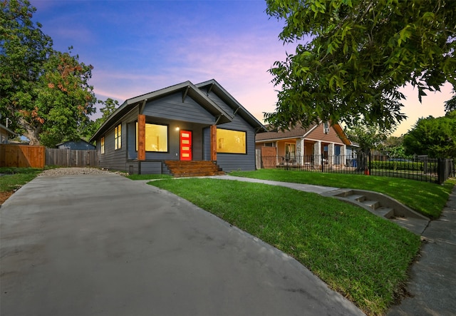 view of front of property with a lawn